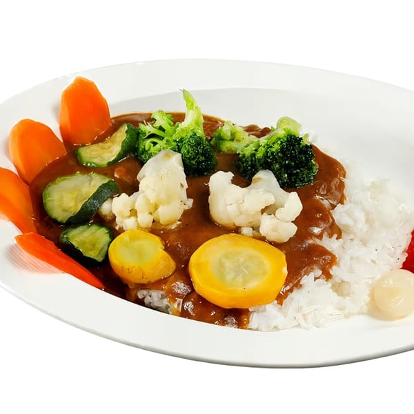 Nippon Curry's vegetable curry with rice, broccoli, carrots, zucchini, cauliflower, and yellow squash.