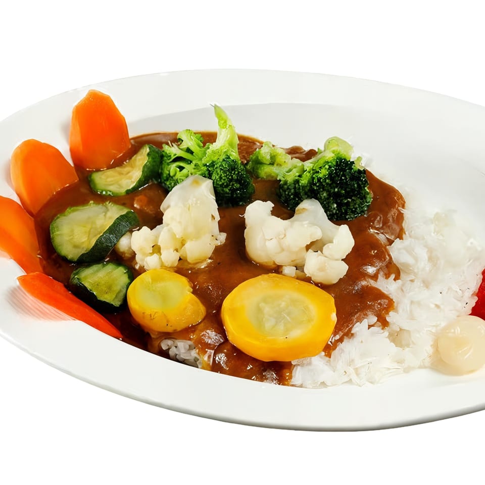 Nippon Curry's vegetable curry with rice, broccoli, carrots, zucchini, cauliflower, and yellow squash.