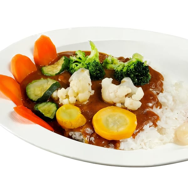 Nippon Curry's vegetable curry with rice, featuring carrots, zucchini, broccoli, cauliflower, and yellow squash.